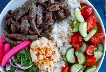 Beef Shawarma Bowl with Rice, Tabouli Salad, Tahini Dressing, and Asparagus
